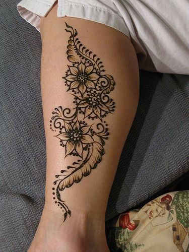 a woman's leg with a tattoo on it