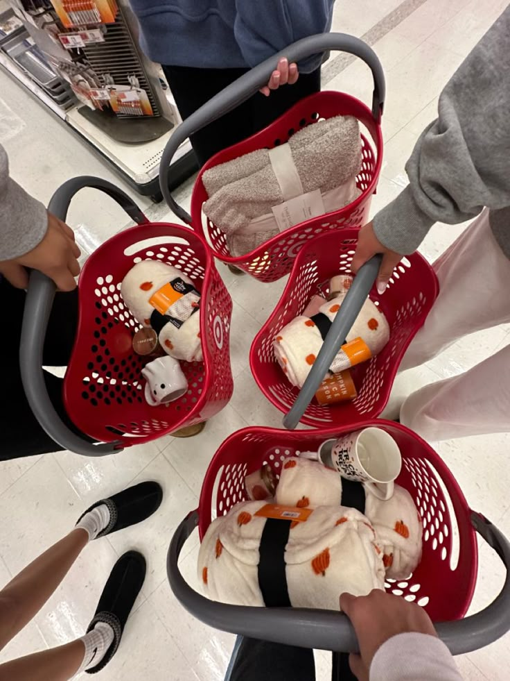 three baskets filled with stuffed animals sitting on top of a floor next to each other