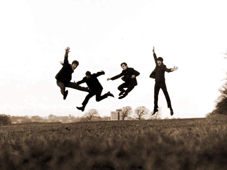 a group of people jumping in the air