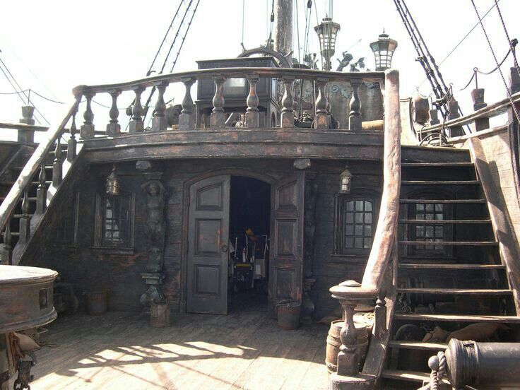 an old pirate ship with stairs leading up to it