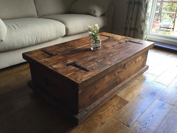 a living room with a couch, coffee table and window