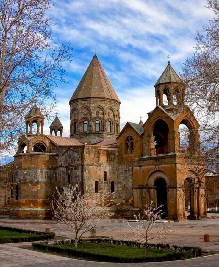 an old building with two towers on top