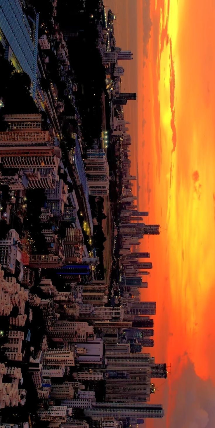 an aerial view of a city at sunset