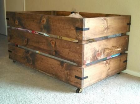 a wooden box sitting on top of a carpeted floor