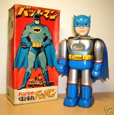 a toy figure next to a box on a table