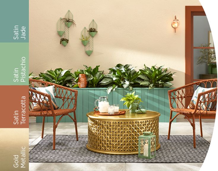 a living room filled with furniture next to a planter and potted greenery