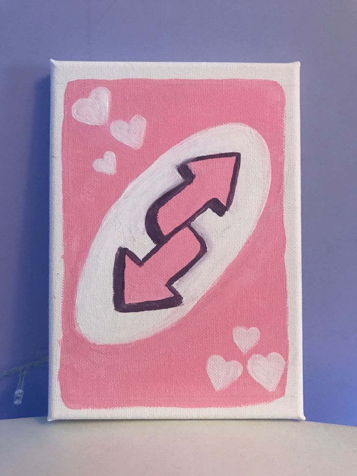 a pink and white painting with hearts on the bottom, an arrow in the middle