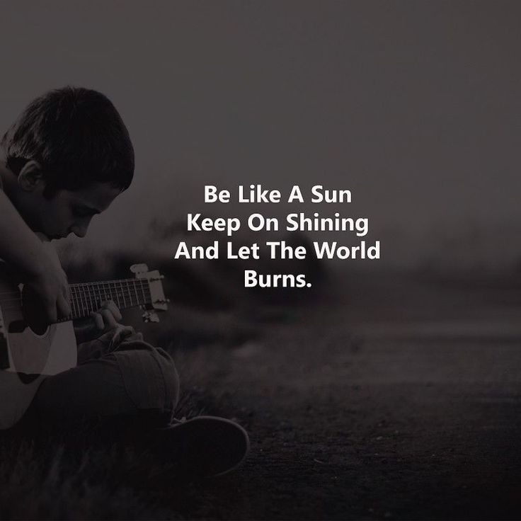 a person sitting on the ground with a guitar in their lap and texting that reads, be like a sun keep on shining and let the world burns