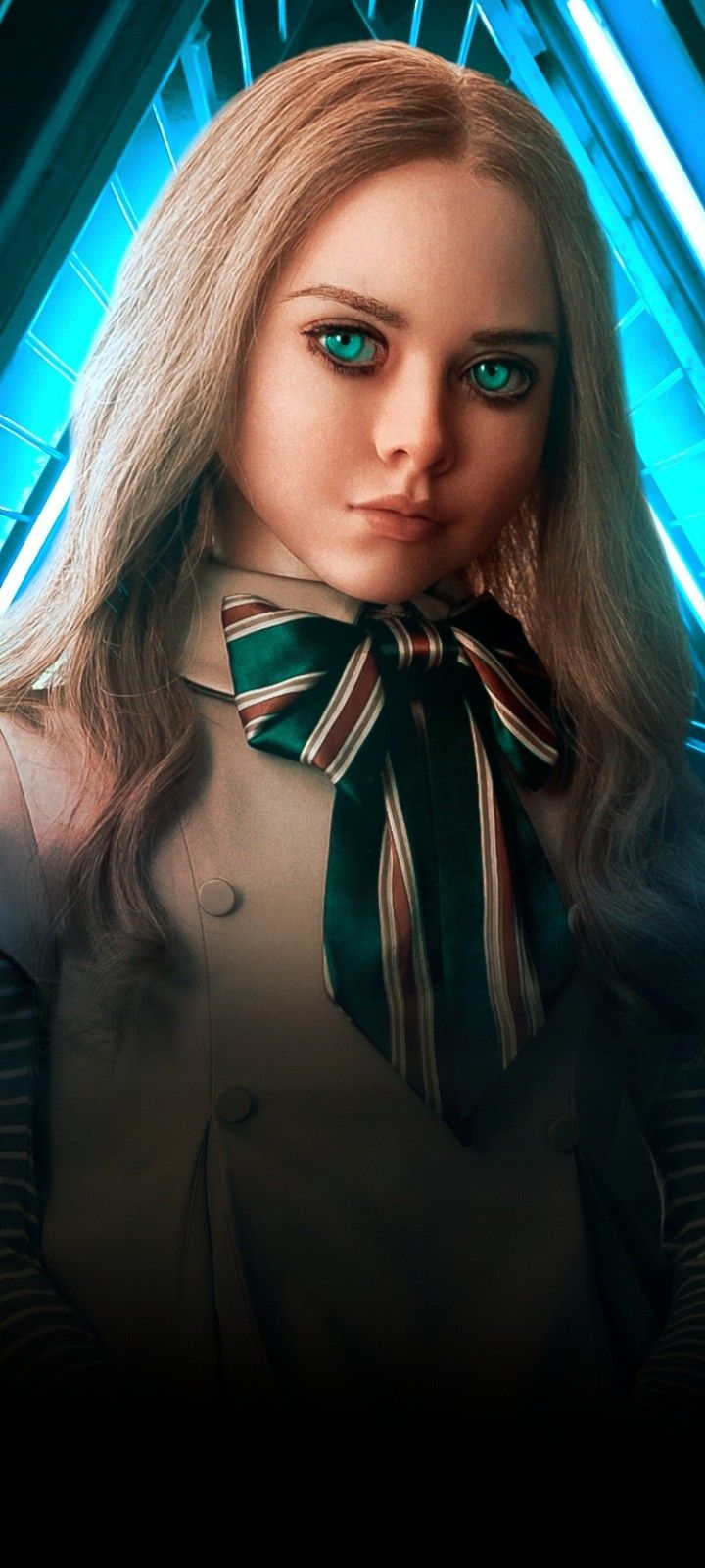 a woman with long blonde hair wearing a green and white striped bow tie, standing in front of a blue background