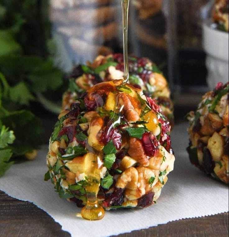 an appetizer is being made with fruit and nuts