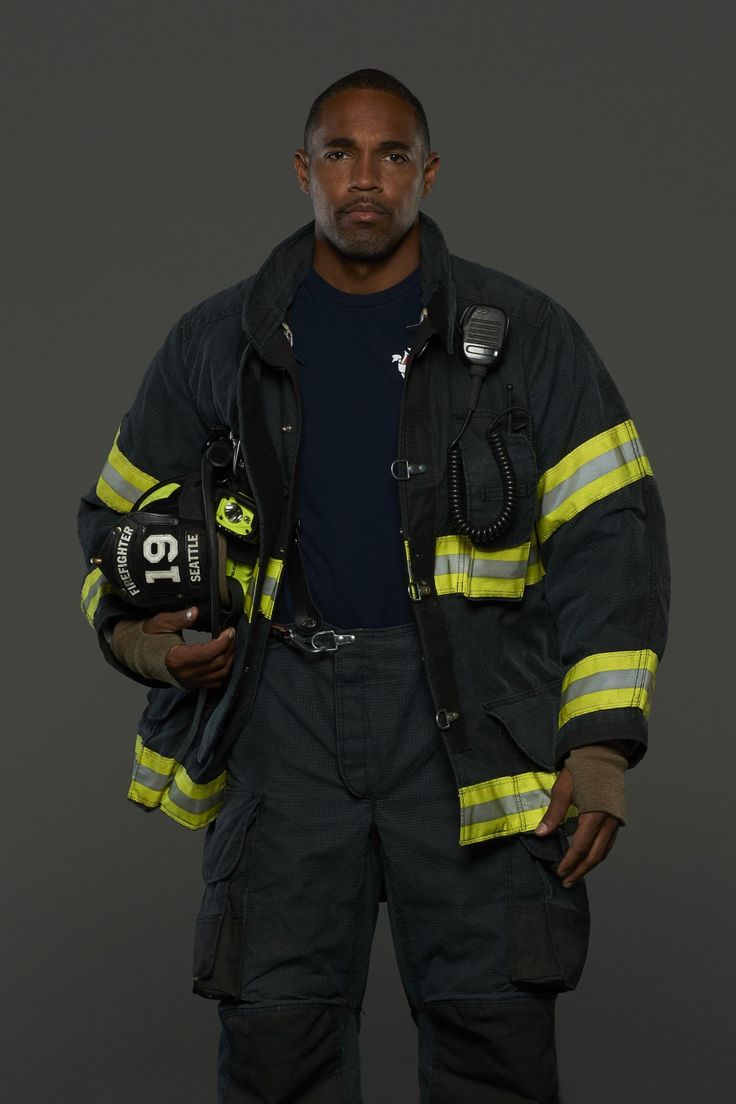 a firefighter is posing for the camera