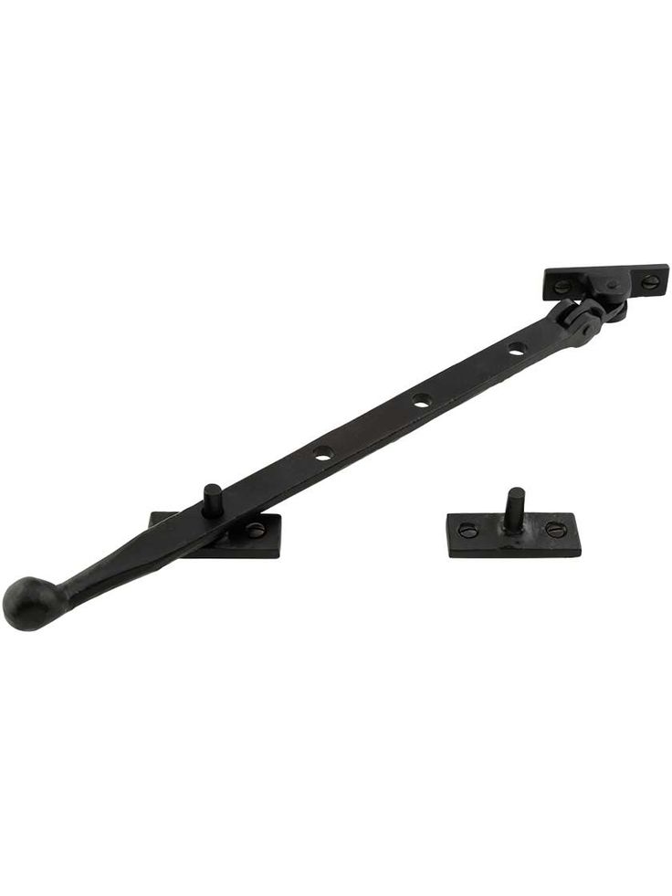 a pair of black iron brackets on a white background