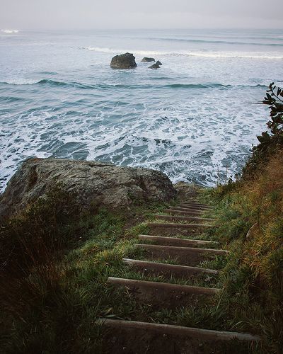 a set of stairs leading to the ocean