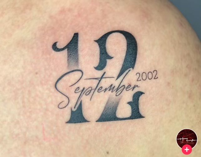 a tattoo with the number two on it