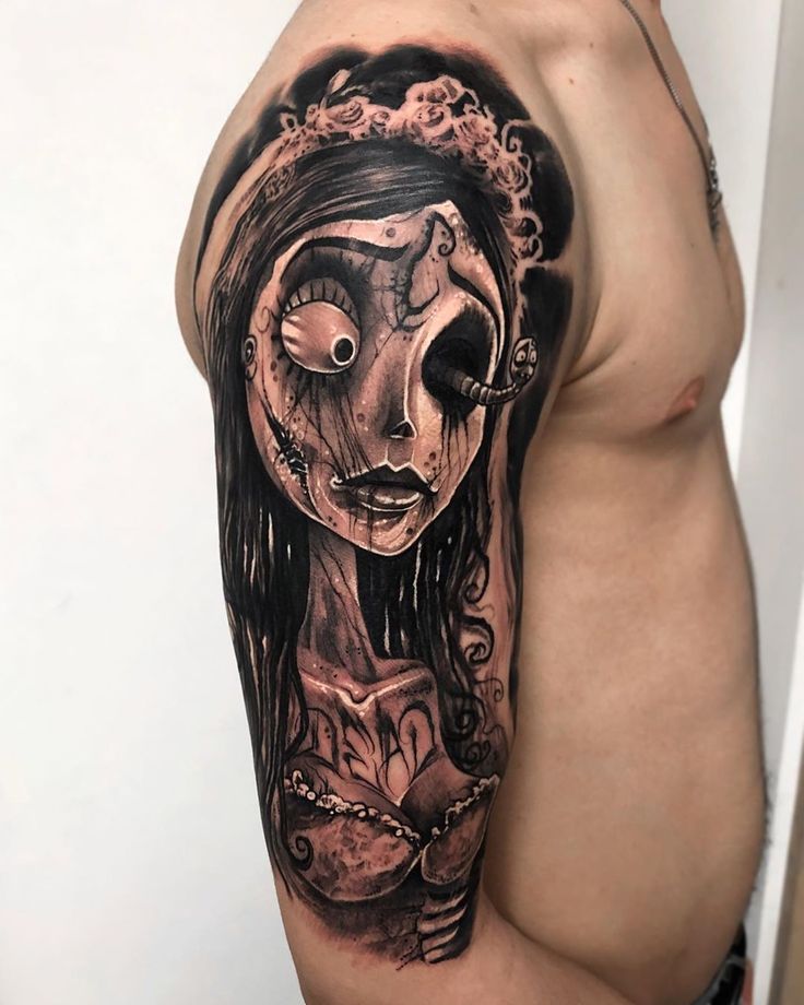 a man with a tattoo on his arm has a woman's face painted on it