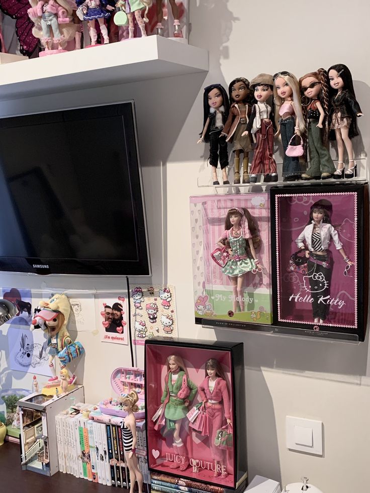 there are many barbie dolls on the shelves above the tv and bookshelf in this room