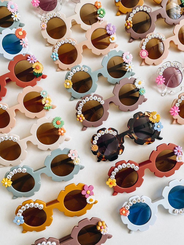 many different colored sunglasses with flowers on them