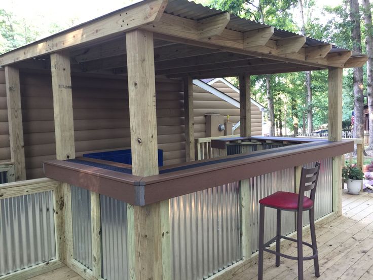 an outdoor hot tub and bar on a deck