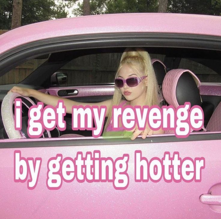 a woman sitting in the drivers seat of a pink car that says i get my revegege by getting hotter