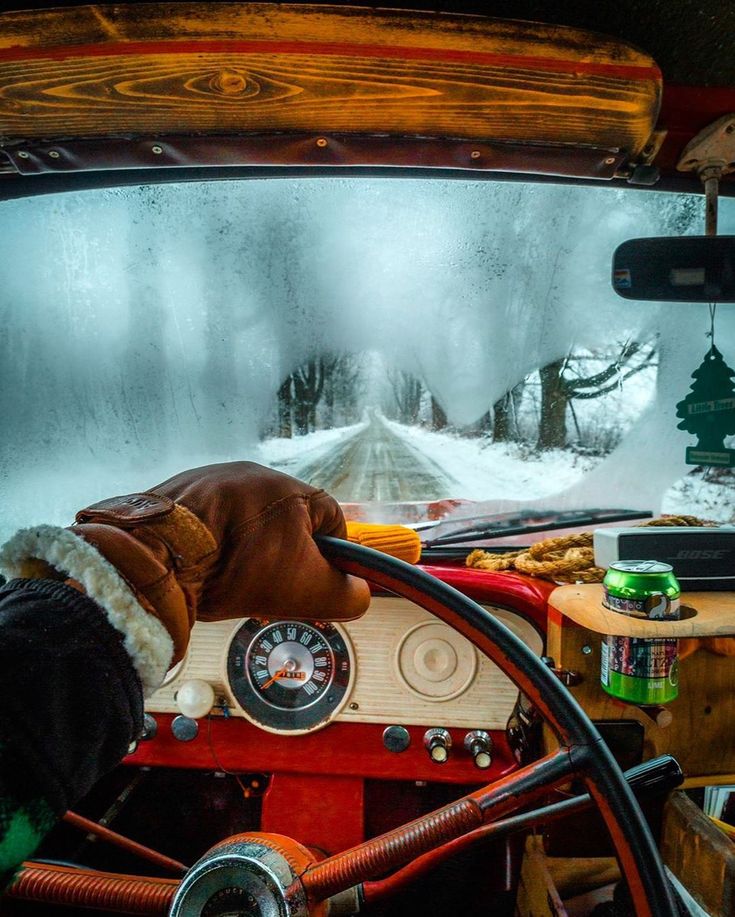 the interior of an old car is covered in snow