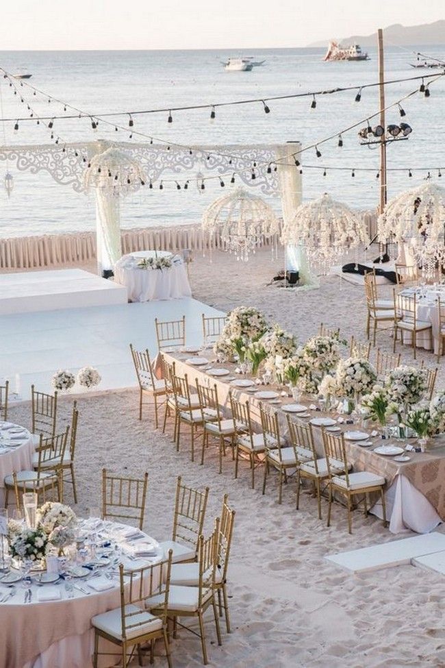 an outdoor wedding set up on the beach