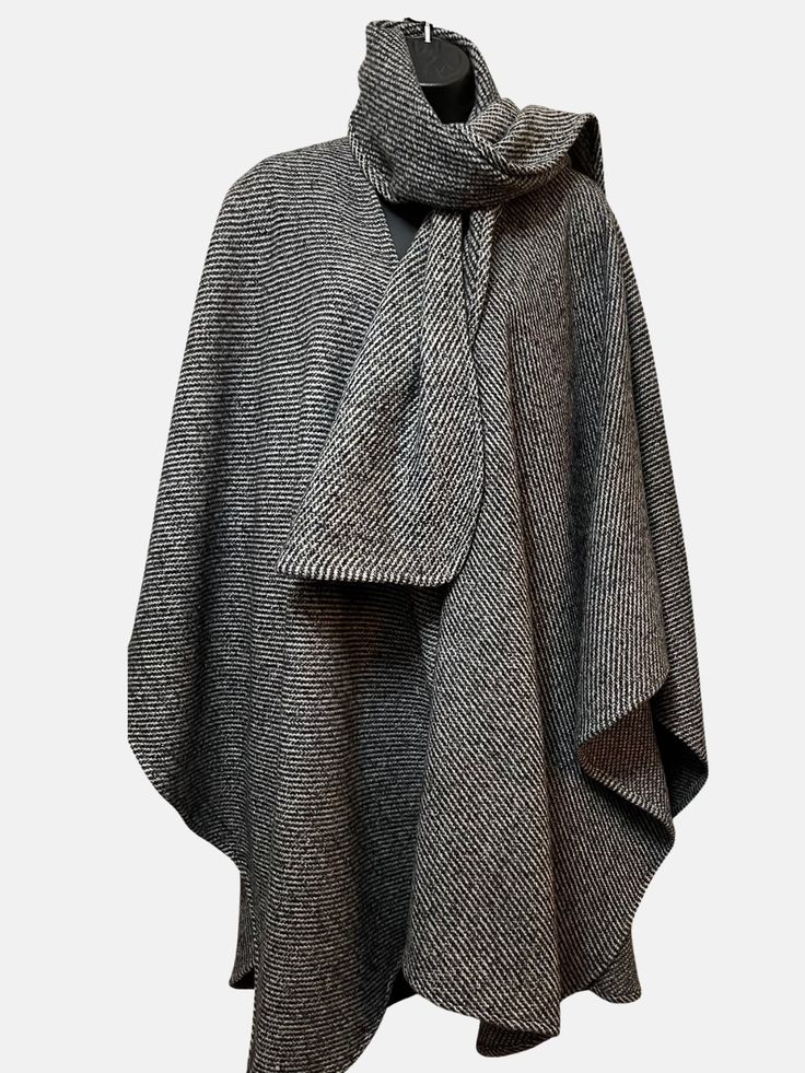 Heavyweight wool blend classic wrap with detached signature matching scarf. Dry clean Classic Wool Cape For Winter, Elegant Oversized Wool Poncho, Chic Wool Poncho For Winter, Classic Wool Cape For Fall, Elegant Wool Poncho For Winter, Oversized Cashmere Wraps For Winter, Winter Cashmere Wrap Outerwear, Elegant Wool Poncho Shawl, Cashmere Wrap For Winter