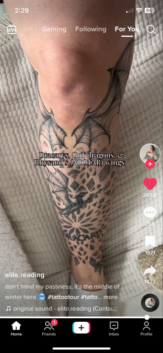 a person with a tattoo on their leg and the caption below reads, gaming following for you