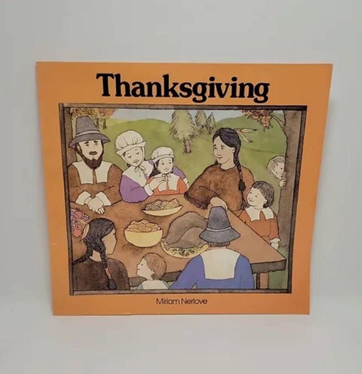 a book with an image of people sitting at a table and the words thanksgiving written on it