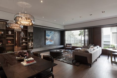 a living room filled with furniture and a large window