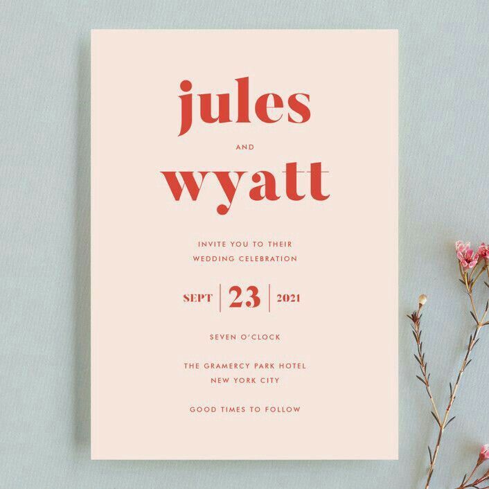 a pink wedding card with the words julias and wyatt printed on it