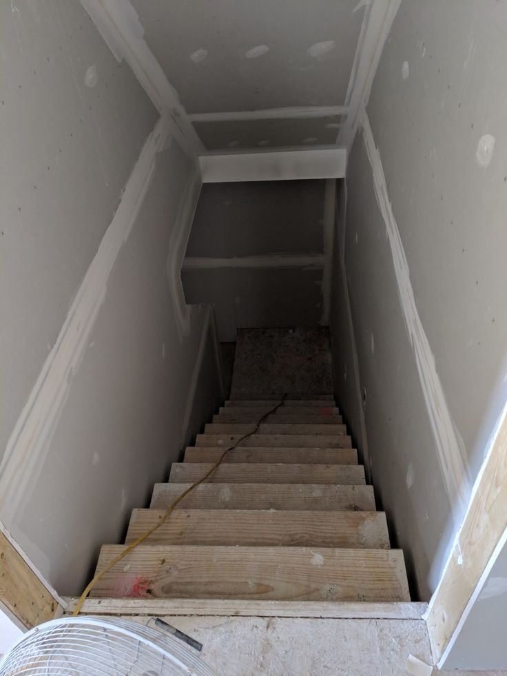 the stairs are being built in an unfinished room