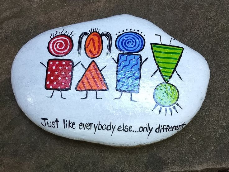 a painted rock that says just like everybody else, only different things on it with colorful designs