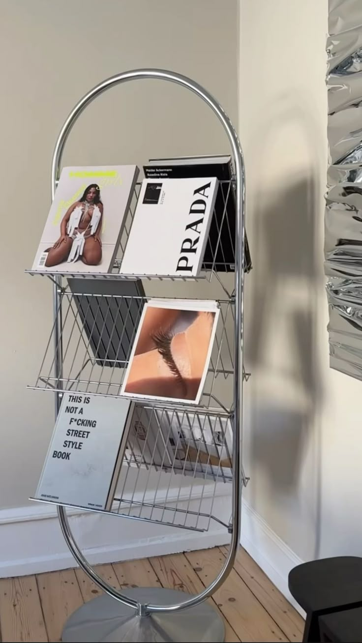 a magazine rack with magazines on it in a room