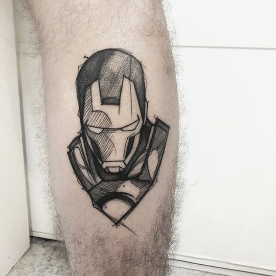 a man's leg with a black and grey iron man tattoo on the calf