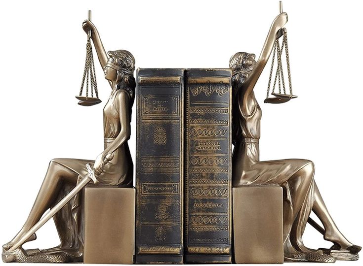 a statue of lady justice sitting on top of two books