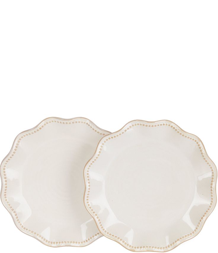 two white plates sitting next to each other