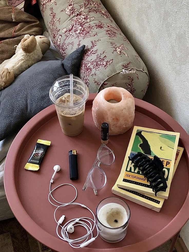 a pink table with various items on it