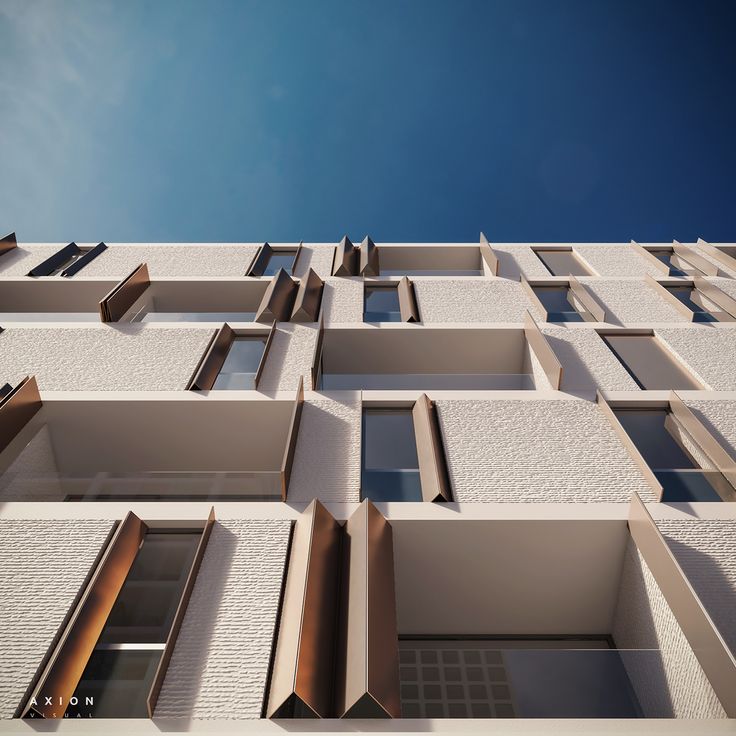 the facade of an apartment building with windows and balconies