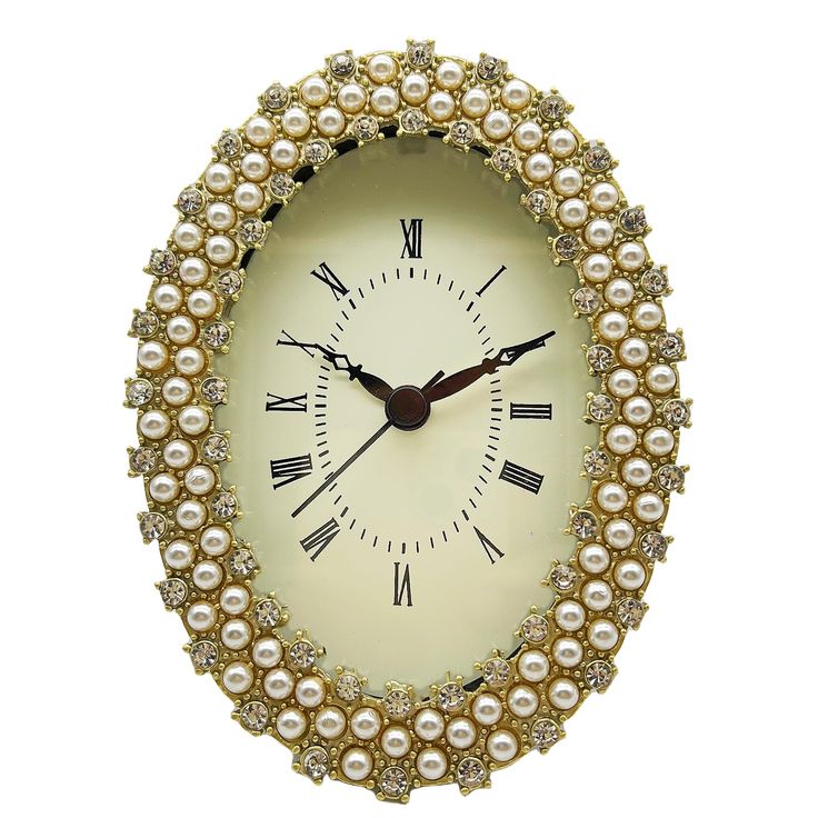 a clock made out of pearls on a white background