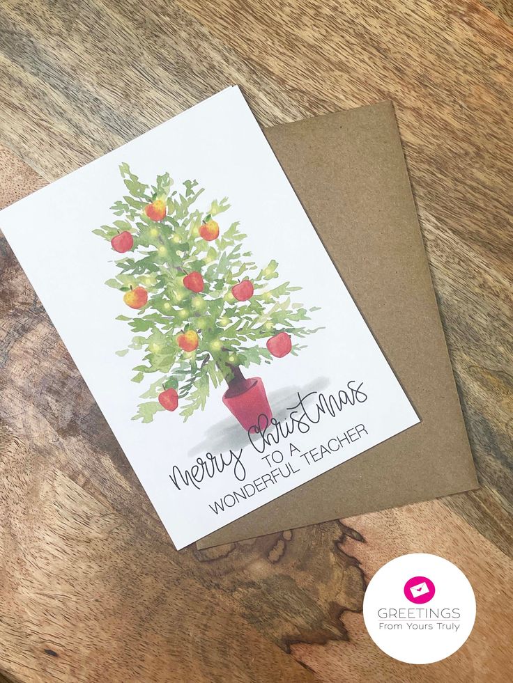 a christmas card with an apple tree on it