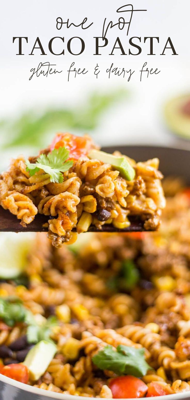 a spoon full of taco pasta on top of a pan with the title above it