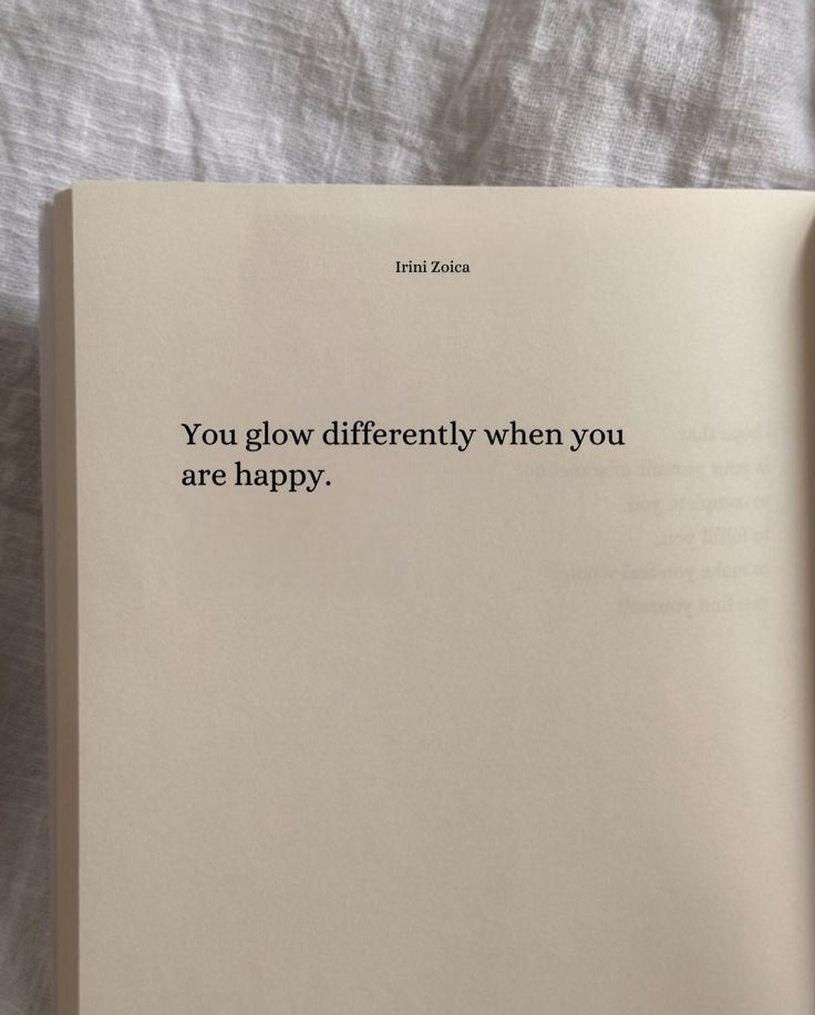 an open book with the words you glow differently when you are happy