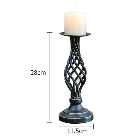 a tall metal candle holder with a white candle on the top and measurements for it