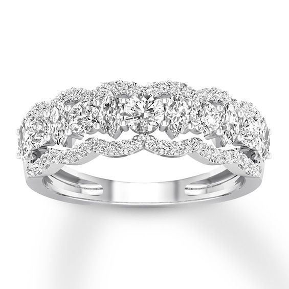 a white gold ring with three rows of diamonds