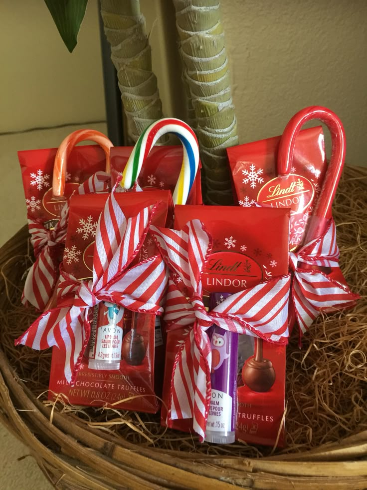 a basket filled with candy canes and candies