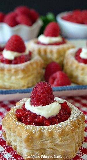 raspberry cream cheese pastries on a red and white checkered tablecloth