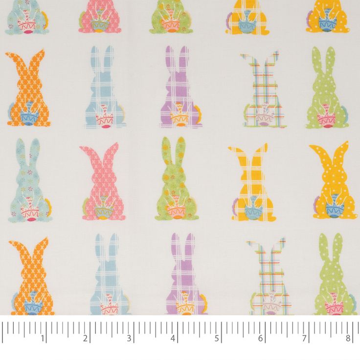 a white fabric with colorful rabbits on it