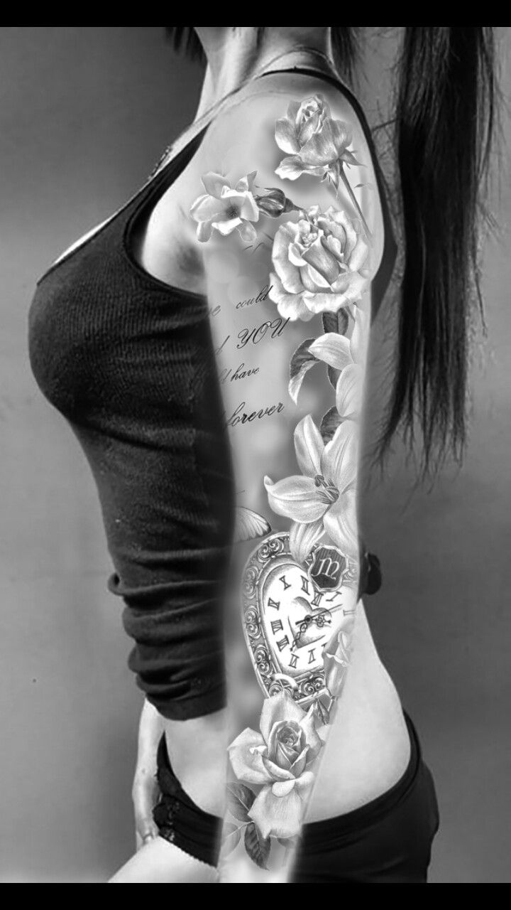 a woman with a tattoo on her arm and chest is holding a clock in front of her back