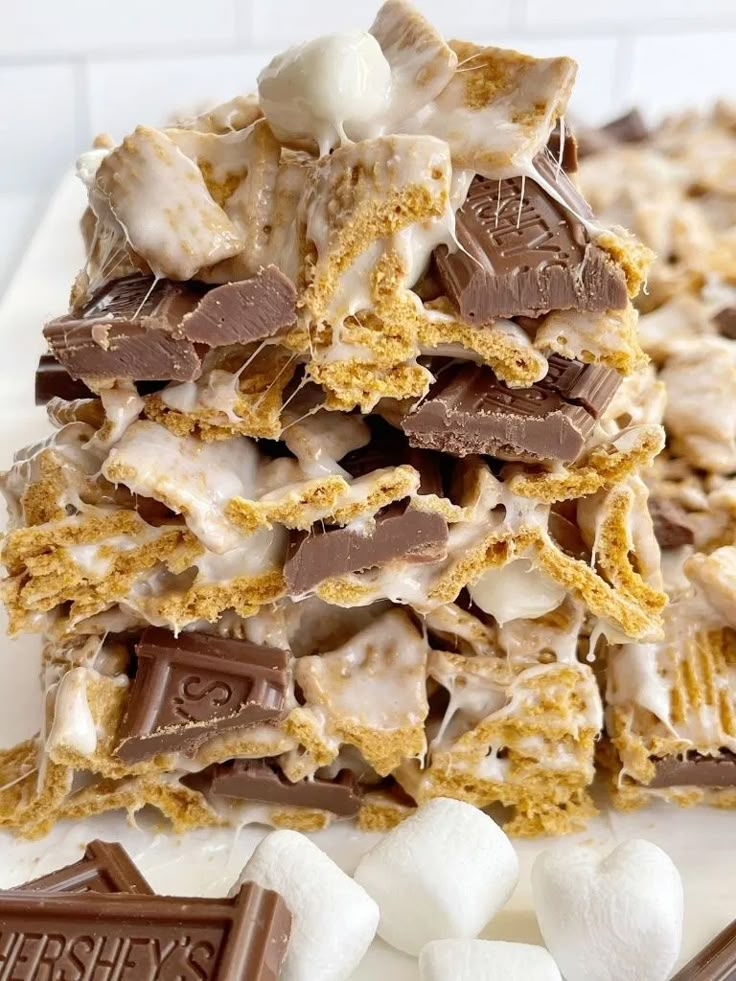 a pile of chocolate and marshmallows on a white plate