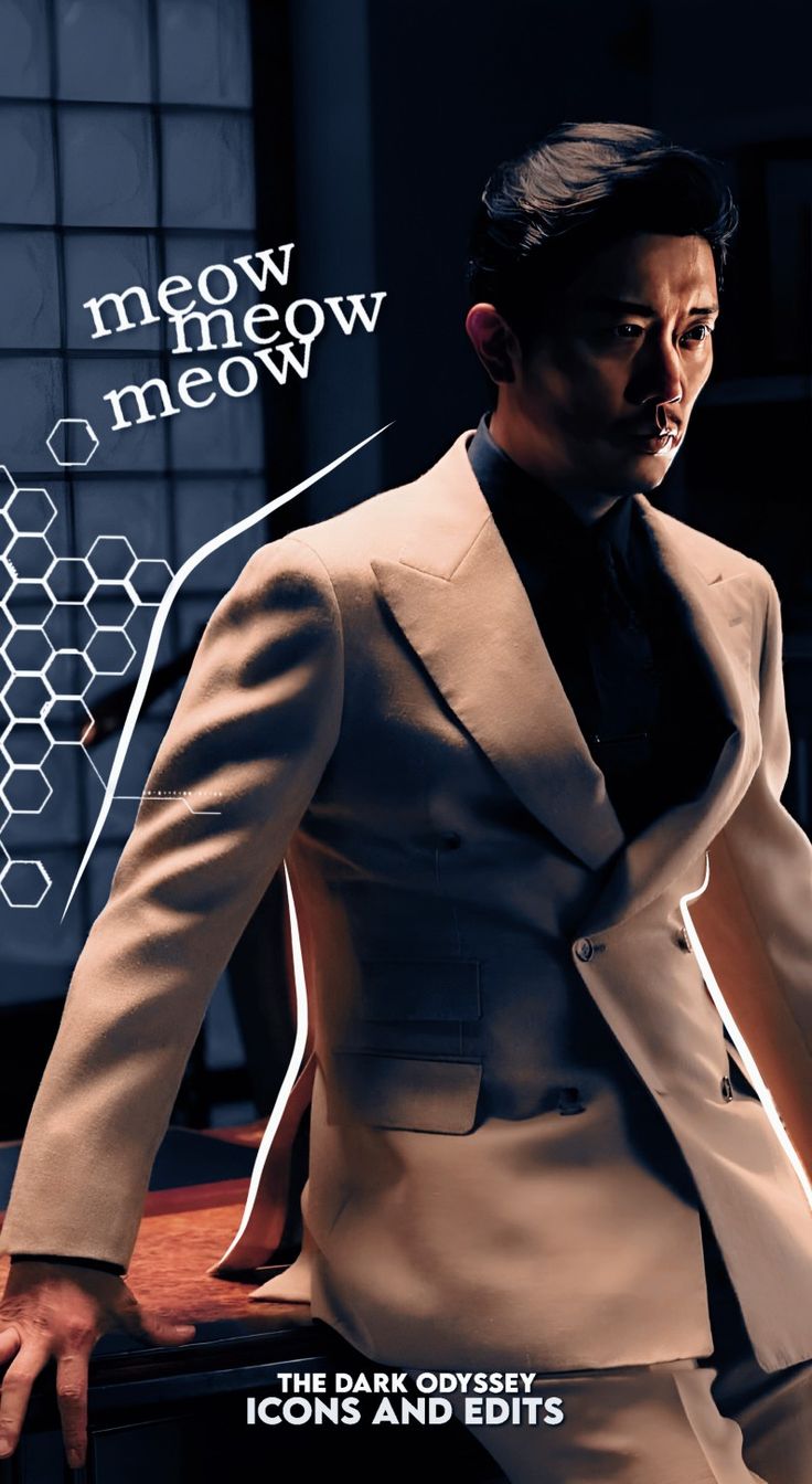 a man in a suit and tie standing next to a wall with the words meow meow meow on it